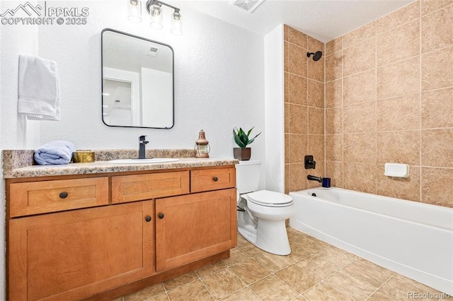 full bathroom with toilet, tiled shower / bath combo, and vanity