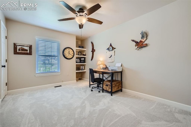 office space with light carpet and ceiling fan