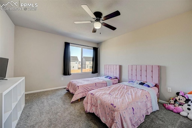 carpeted bedroom with ceiling fan and a textured ceiling