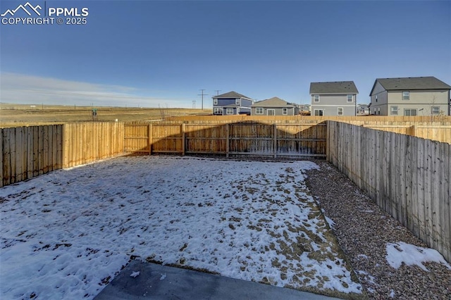 view of yard covered in snow