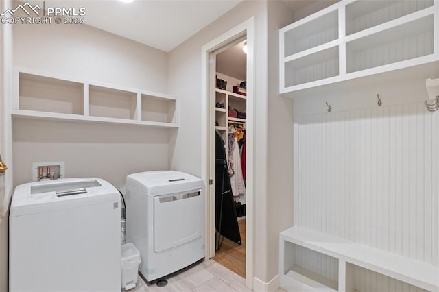 laundry area with washing machine and clothes dryer