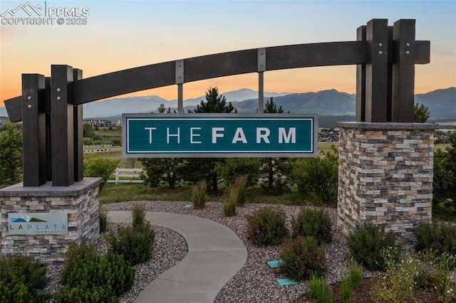 community sign featuring a mountain view