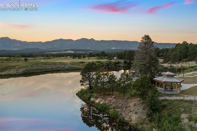 mountain view with a rural view and a water view