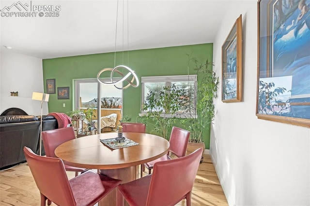 dining space with light wood-type flooring