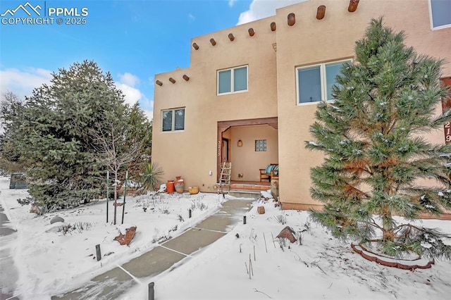 view of snow covered property