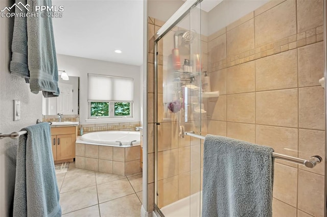 bathroom with vanity, shower with separate bathtub, and tile patterned floors