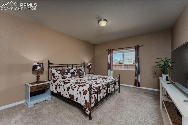 bedroom featuring carpet floors and baseboards
