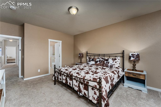 carpeted bedroom featuring baseboards