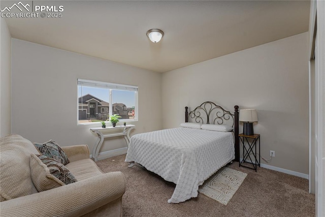 bedroom featuring carpet floors and baseboards