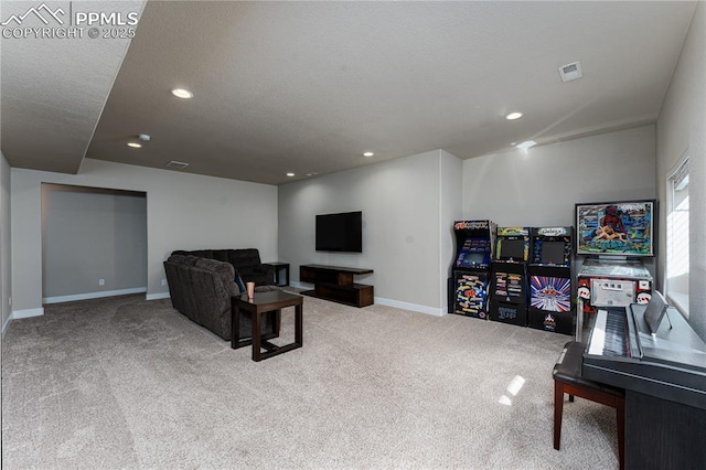 living room featuring carpet, baseboards, and recessed lighting