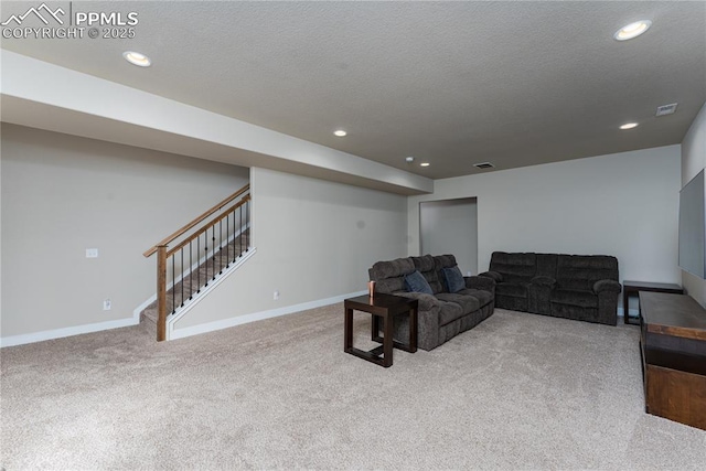 carpeted living room with baseboards, stairway, recessed lighting, and a textured ceiling