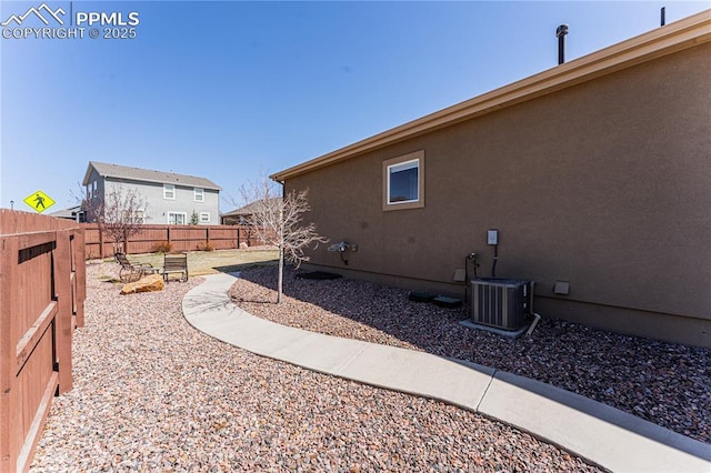 fenced backyard with central AC