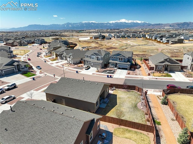 aerial perspective of suburban area featuring a mountainous background