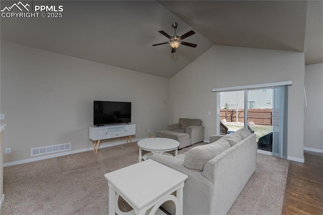 living area featuring ceiling fan, high vaulted ceiling, baseboards, and wood finished floors
