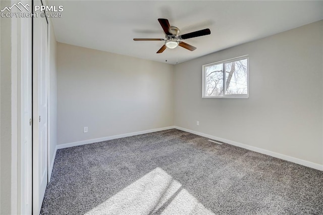 carpeted empty room with ceiling fan