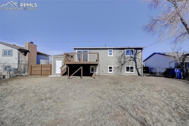 back of house featuring a deck