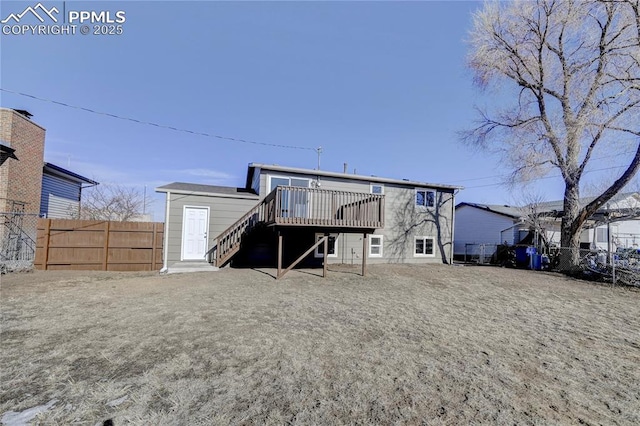 rear view of property featuring a deck