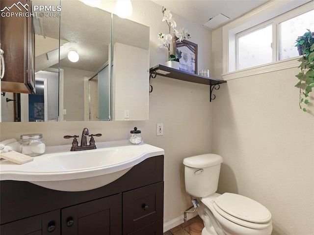 bathroom with toilet and vanity