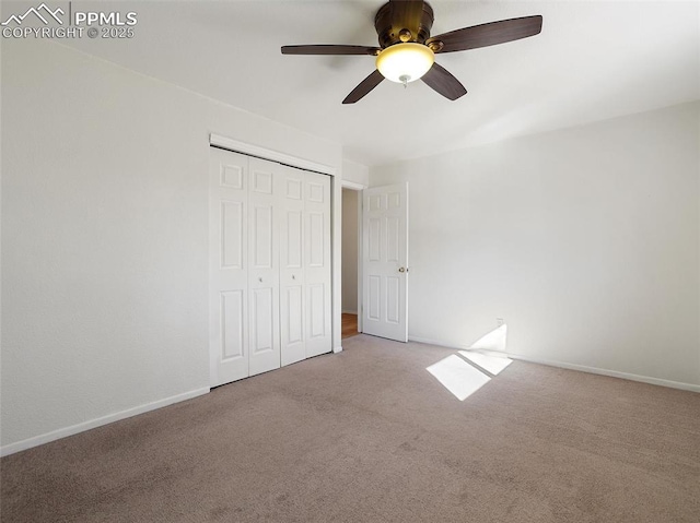 unfurnished bedroom with light carpet, a closet, and ceiling fan