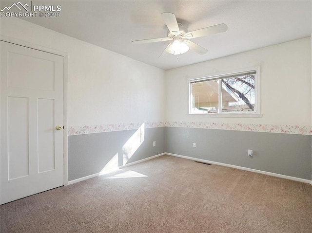 unfurnished room featuring light carpet and ceiling fan