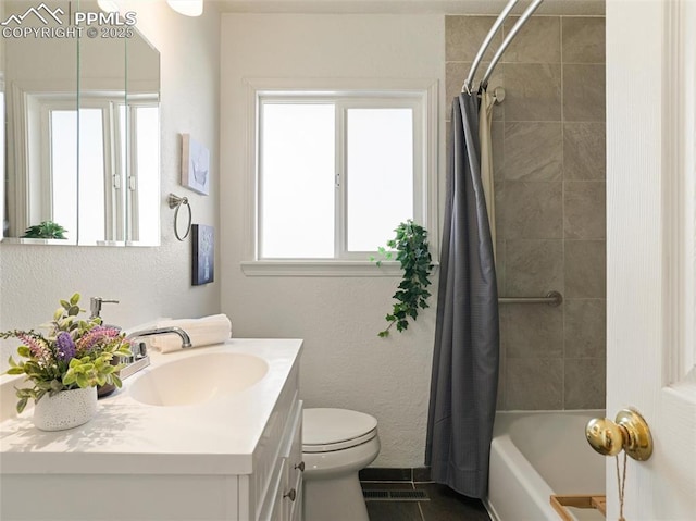 full bathroom with toilet, vanity, tile patterned floors, and shower / bath combo with shower curtain