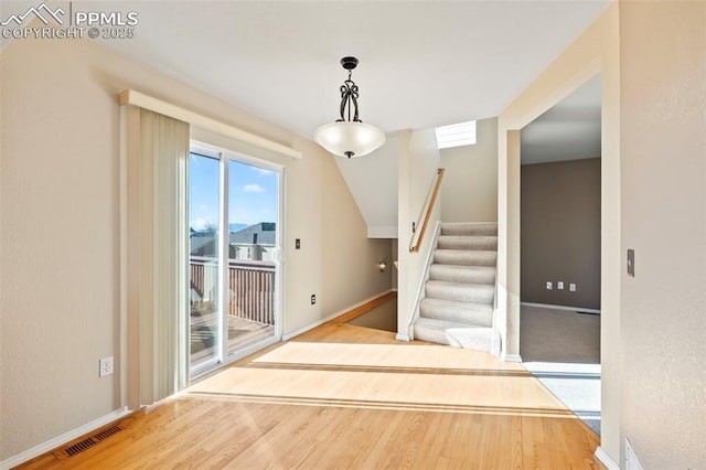 foyer with hardwood / wood-style flooring