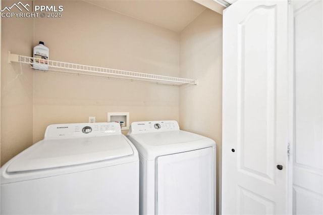 clothes washing area featuring independent washer and dryer