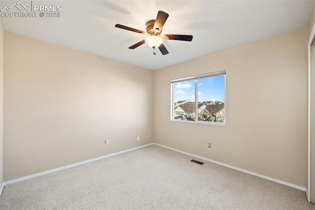 unfurnished room with carpet and ceiling fan