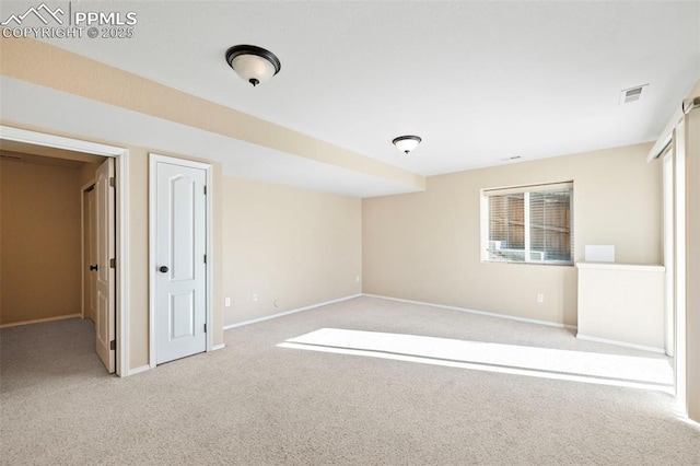 unfurnished bedroom with light colored carpet