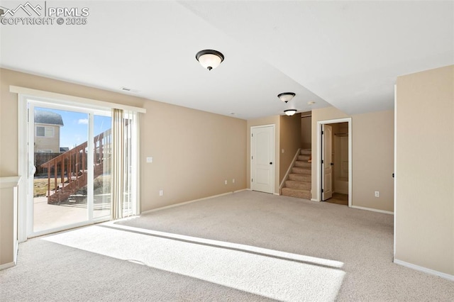 unfurnished room with light colored carpet