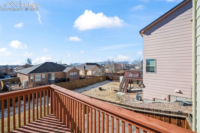 wooden terrace featuring central AC unit