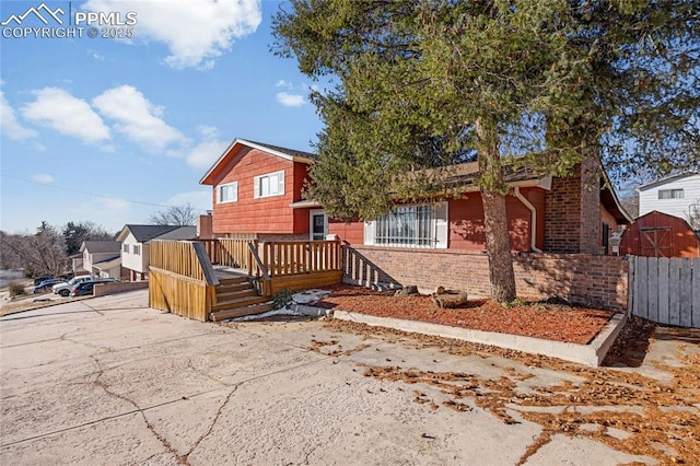 view of front of house featuring a wooden deck