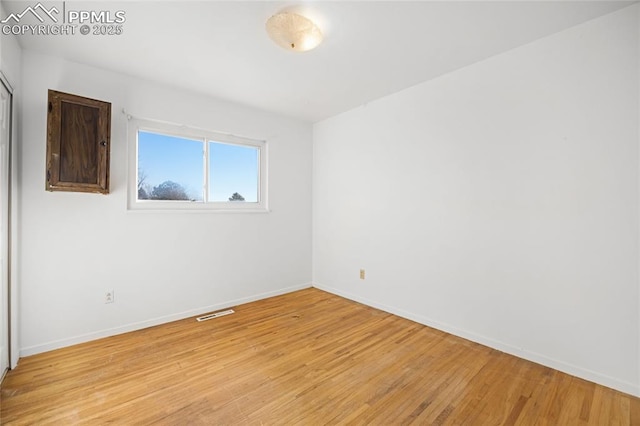 unfurnished room with light hardwood / wood-style flooring