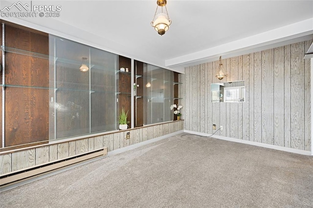 empty room with carpet flooring and a baseboard radiator