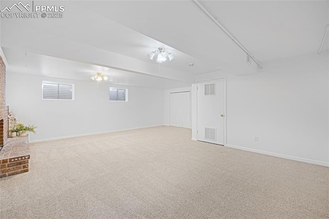 basement featuring carpet flooring