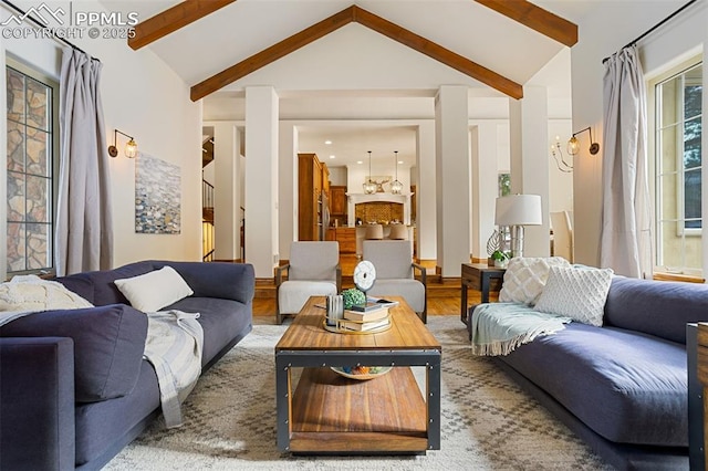 living room featuring lofted ceiling with beams