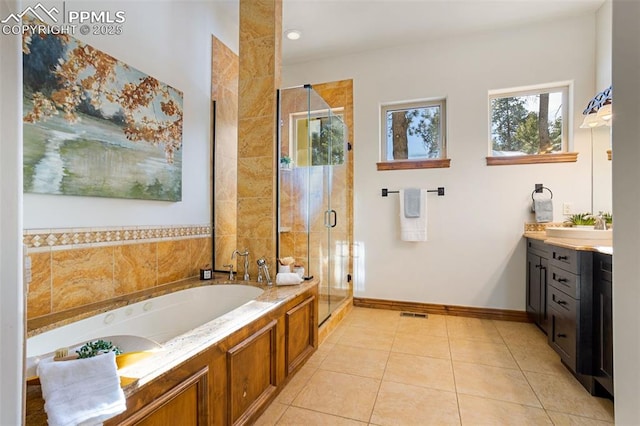 bathroom with vanity, tile patterned floors, and separate shower and tub