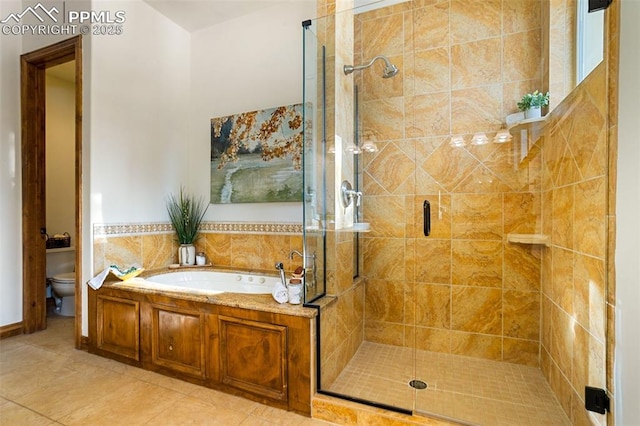 bathroom featuring tile patterned flooring, shower with separate bathtub, and toilet