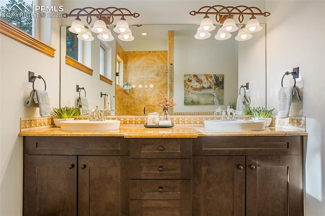 bathroom featuring vanity and a shower