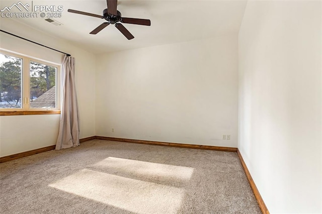 carpeted spare room with ceiling fan