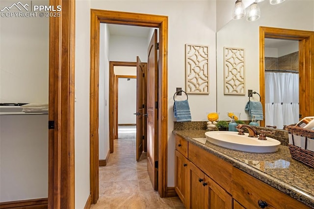 bathroom with tile patterned flooring and vanity