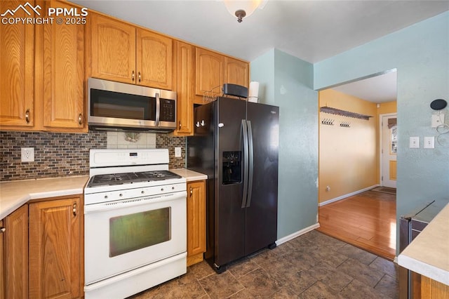 kitchen featuring backsplash and stainless steel appliances