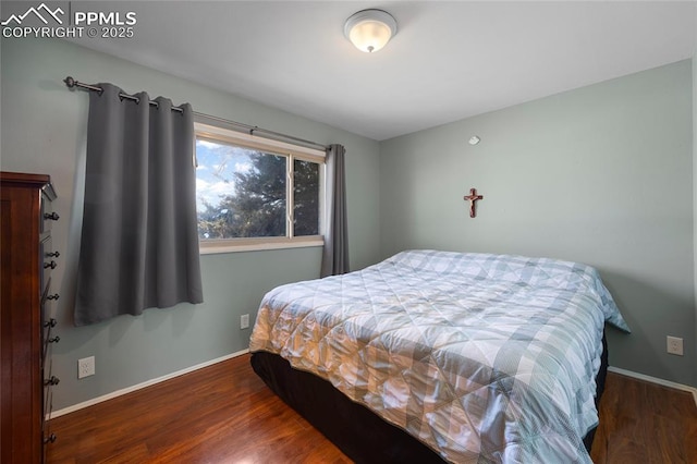 bedroom featuring dark hardwood / wood-style floors