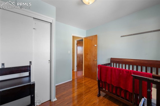 bedroom with hardwood / wood-style floors