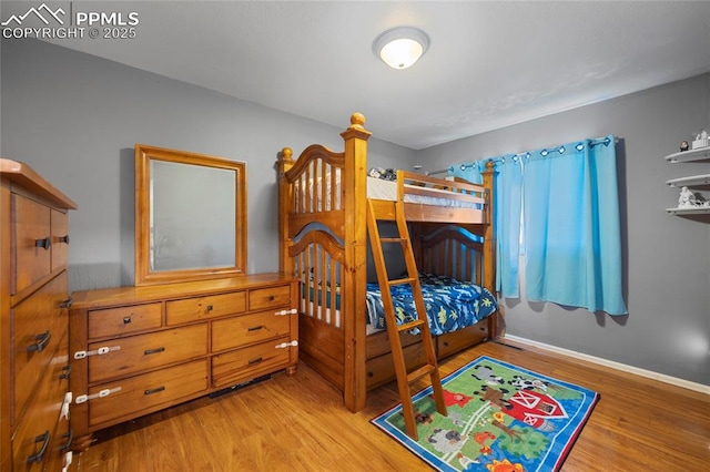 bedroom with hardwood / wood-style floors