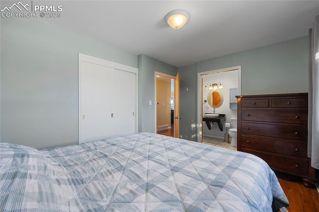 bedroom featuring a closet and ensuite bathroom