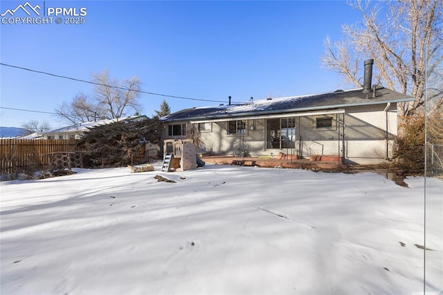 view of snow covered property