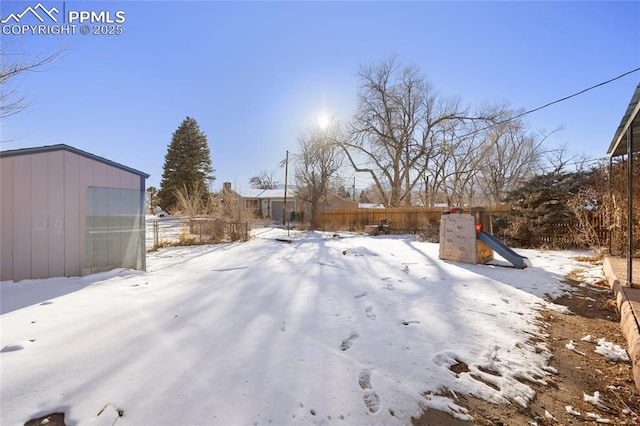 view of yard layered in snow