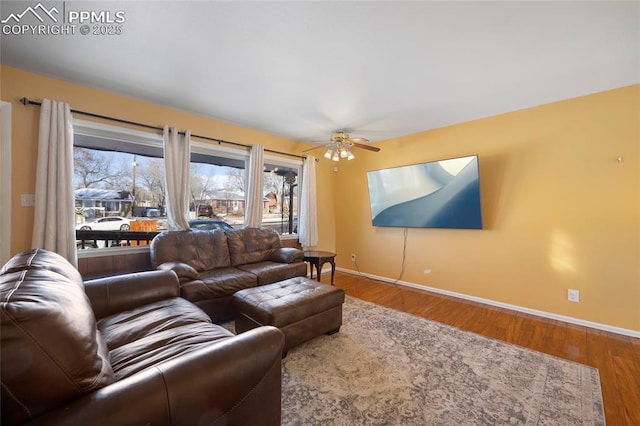 living room with ceiling fan and hardwood / wood-style floors