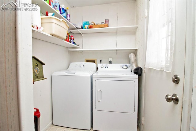 clothes washing area with washer and dryer